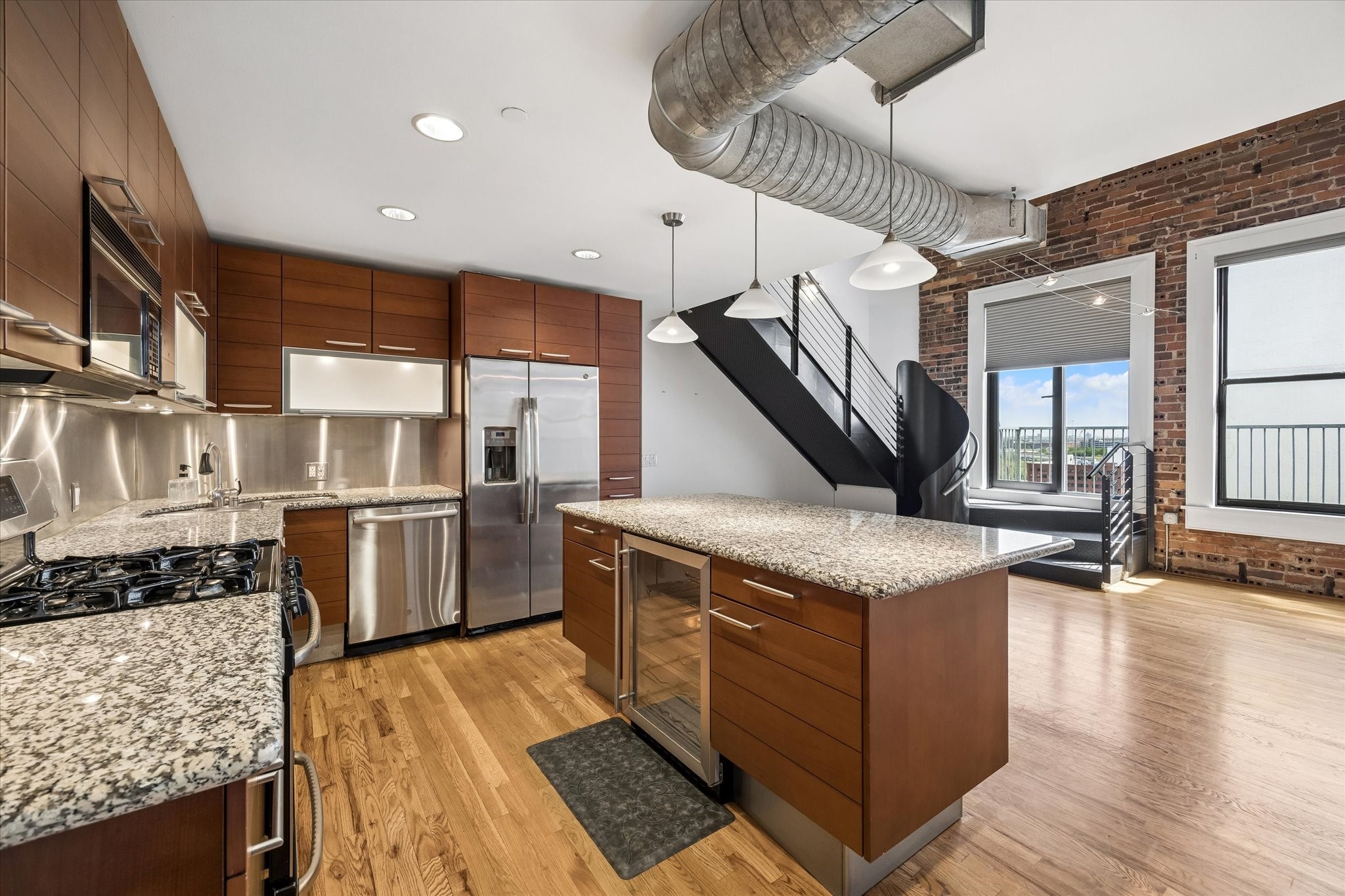 915 Franklin Street, Unit 9L Houston, TX 77002 - Photo 9 of 50 Kitchen area with island and Poggenpohl cabinetry.