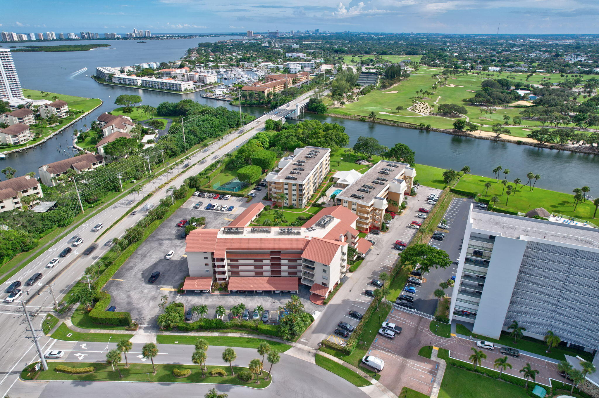 an aerial view of a house with a garden and lake view