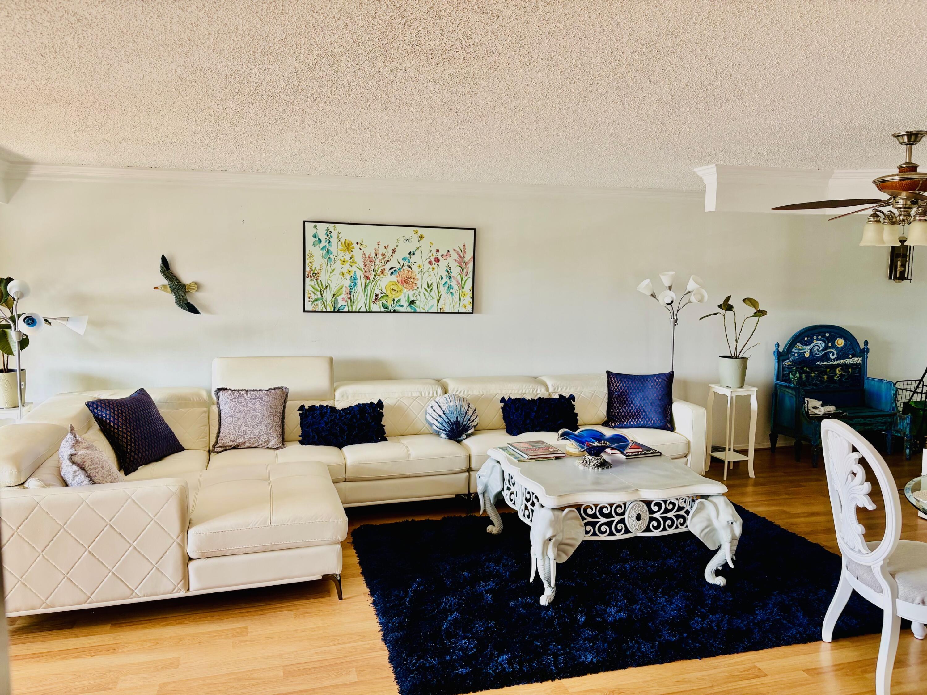 300 Golfview Road, Unit 407 North Palm Beach, FL 33408 - Photo 11 of 56 a living room with furniture and rug