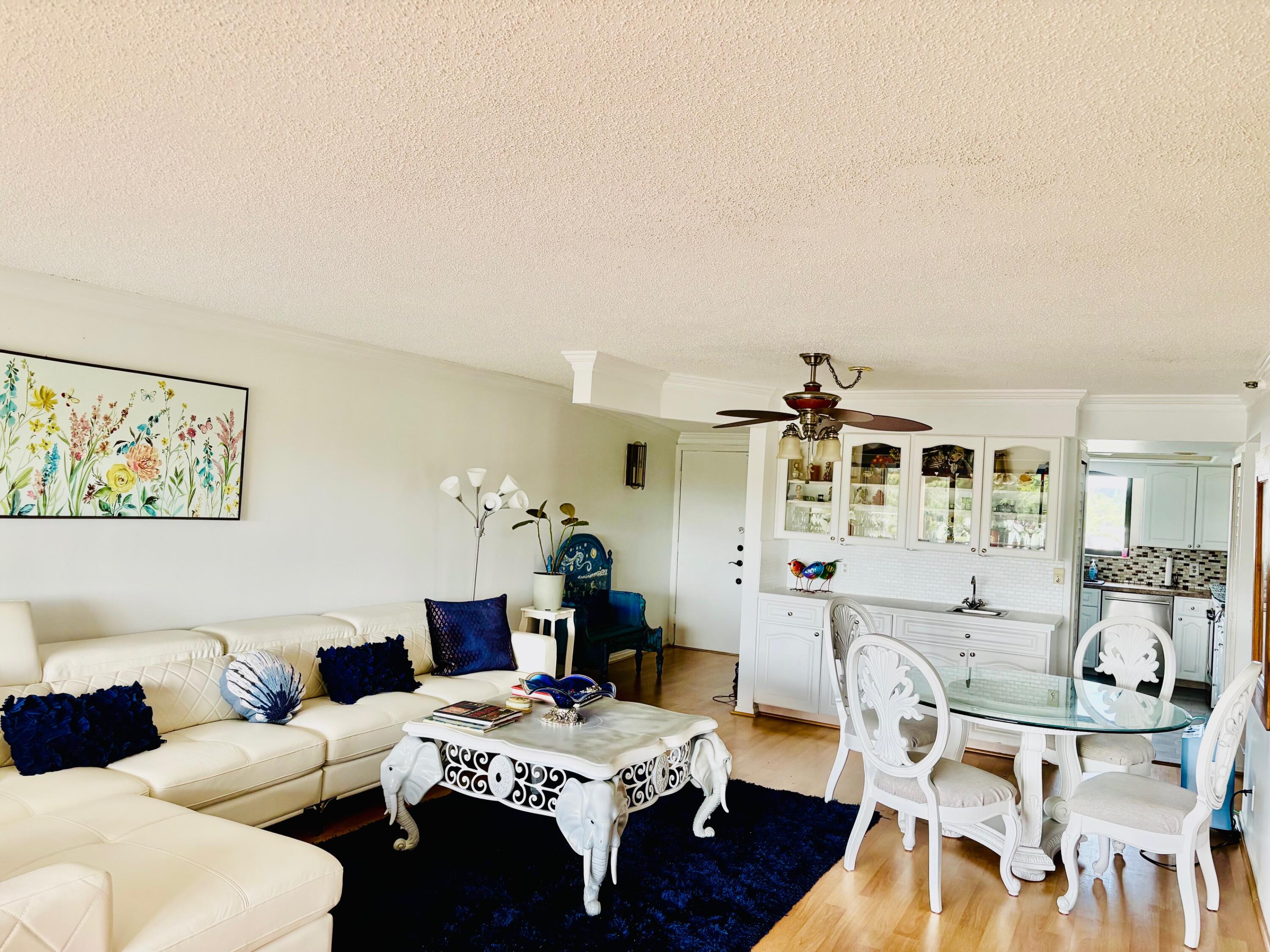 300 Golfview Road, Unit 407 North Palm Beach, FL 33408 - Photo 12 of 56 a living room with furniture and wooden floor