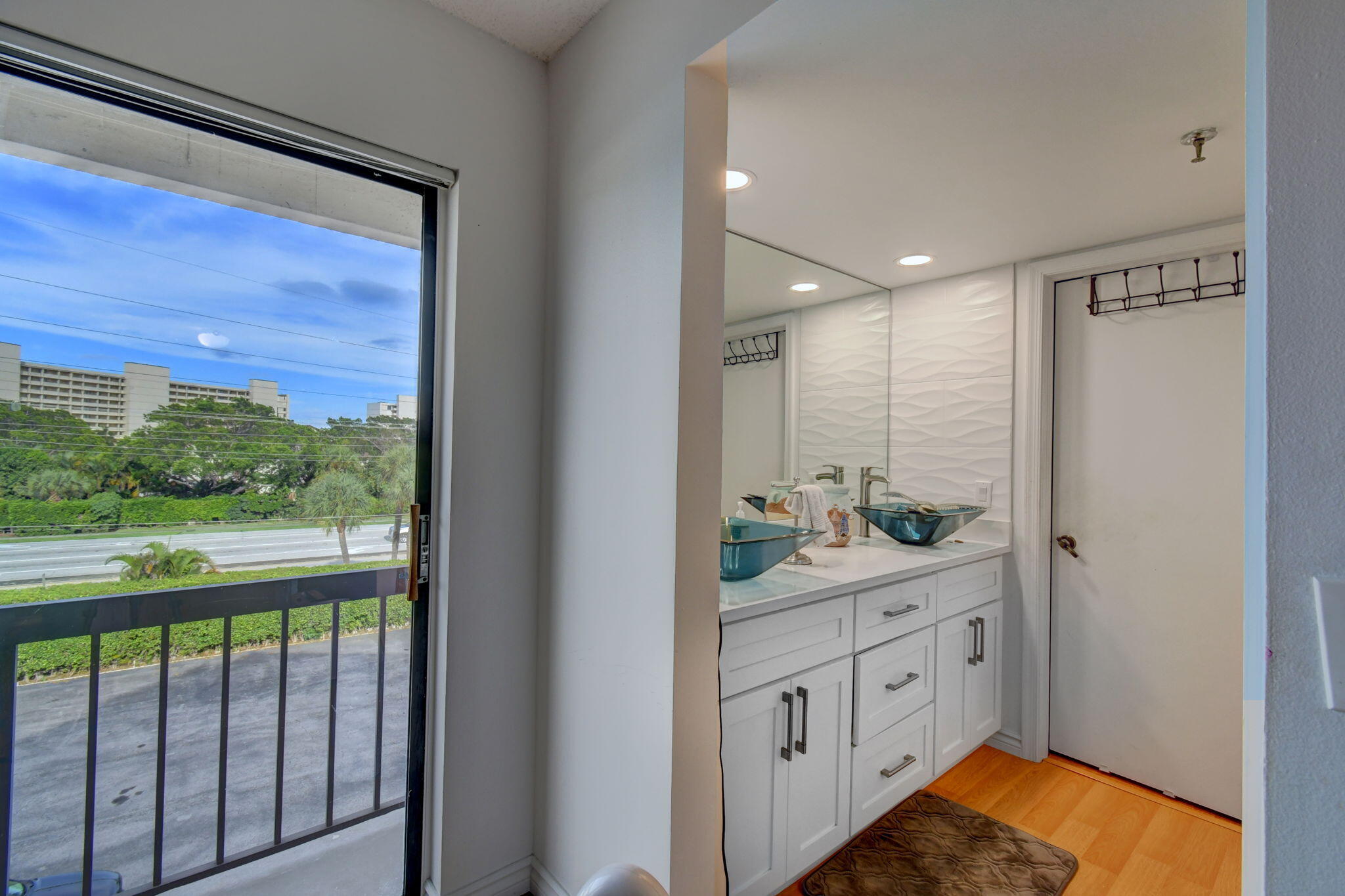 300 Golfview Road, Unit 407 North Palm Beach, FL 33408 - Photo 21 of 56 a bathroom with a double vanity sink and a mirror