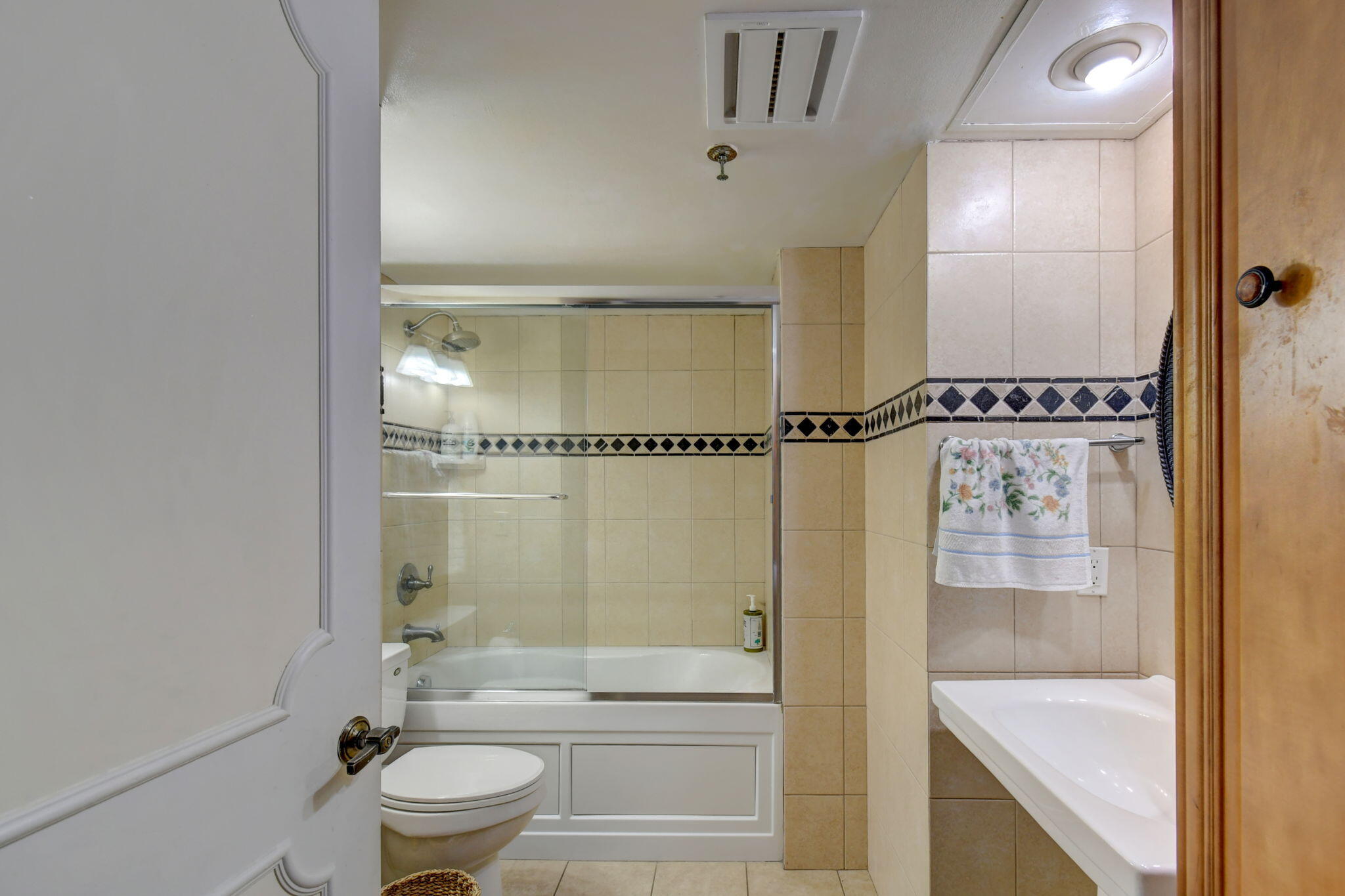 300 Golfview Road, Unit 407 North Palm Beach, FL 33408 - Photo 25 of 56 a bathroom with a granite countertop bathtub shower sink vanity and toilet