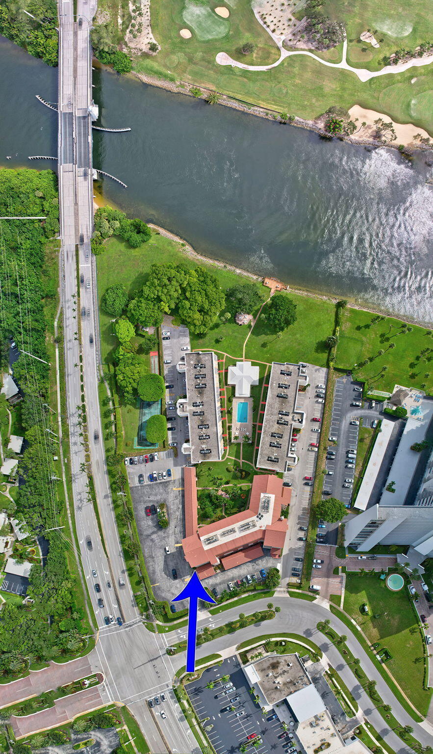 300 Golfview Road, Unit 407 North Palm Beach, FL 33408 - Photo 3 of 56 a view of a tennis ground with large trees