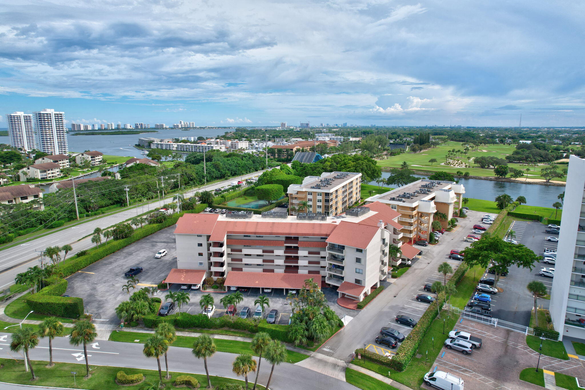 300 Golfview Road, Unit 407 North Palm Beach, FL 33408 - Photo 35 of 56 an aerial view of a city with lots of residential buildings ocean and mountain view in back