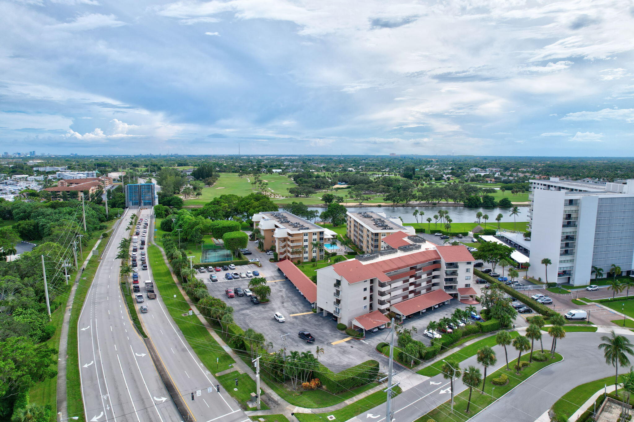 300 Golfview Road, Unit 407 North Palm Beach, FL 33408 - Photo 36 of 56 an aerial view of a house with a garden and lake view