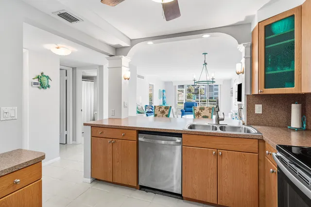 a kitchen with sink and cabinets