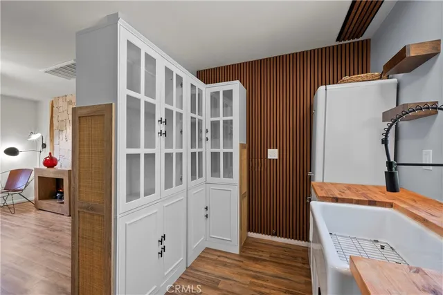 a view of an entryway with wooden floor and windows