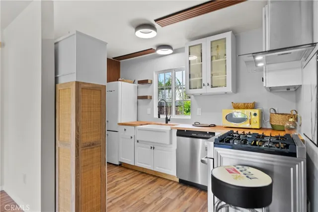 a kitchen with a stove and a refrigerator
