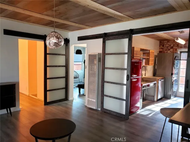 a view of a livingroom with furniture and a window