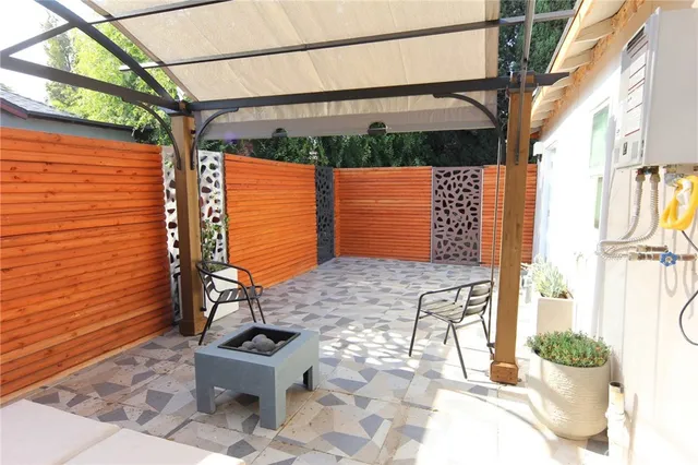 an aerial view of a house with a yard and garden