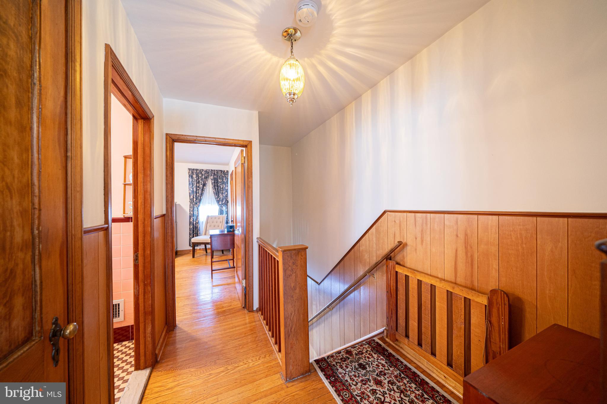 7409 Shisler Street Philadelphia, PA 19111 - Photo 11 of 27 a view of hallway with a bathtub and a chandelier