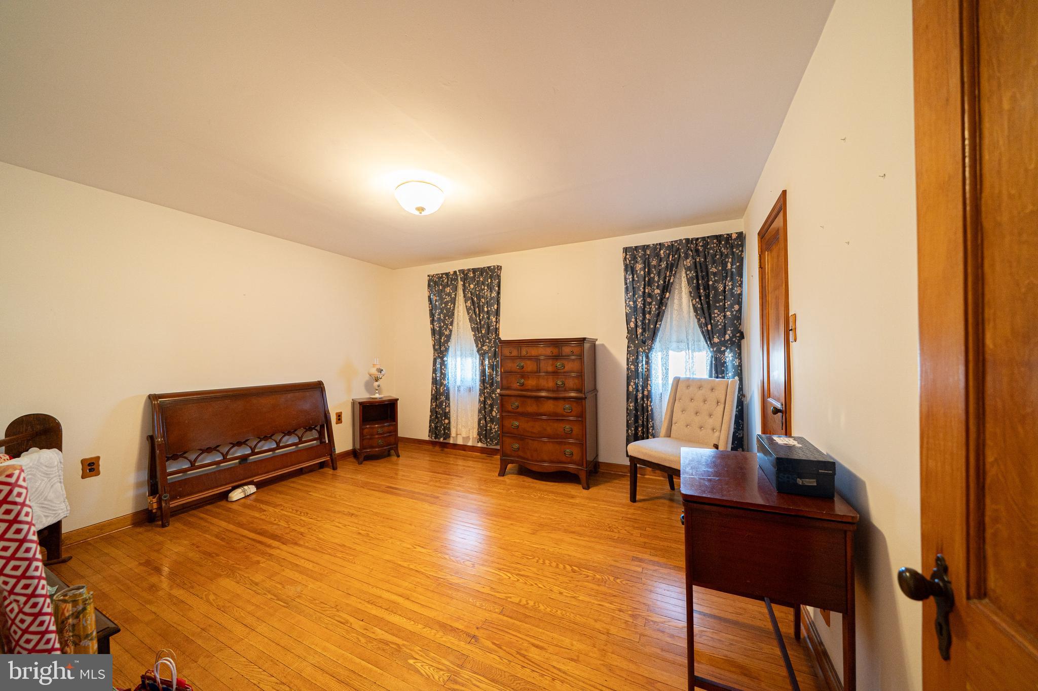 7409 Shisler Street Philadelphia, PA 19111 - Photo 13 of 27 a bedroom with furniture and a flat screen tv