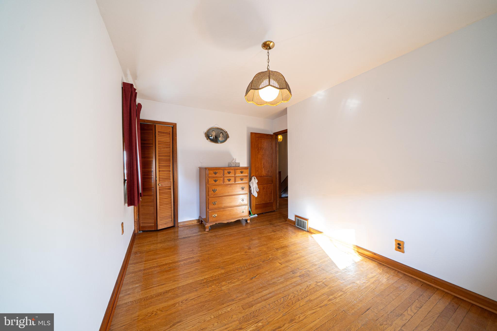 7409 Shisler Street Philadelphia, PA 19111 - Photo 17 of 27 a view of an empty room with wooden floor