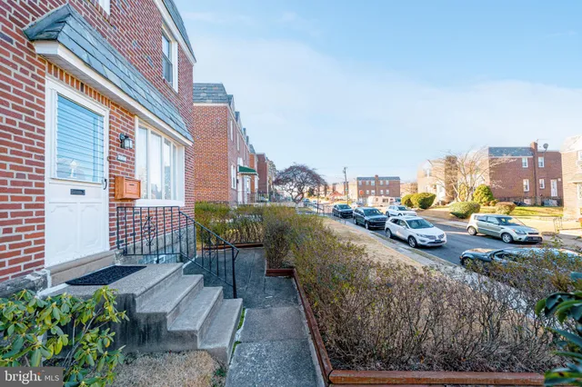 a view of a chairs and table in backyard