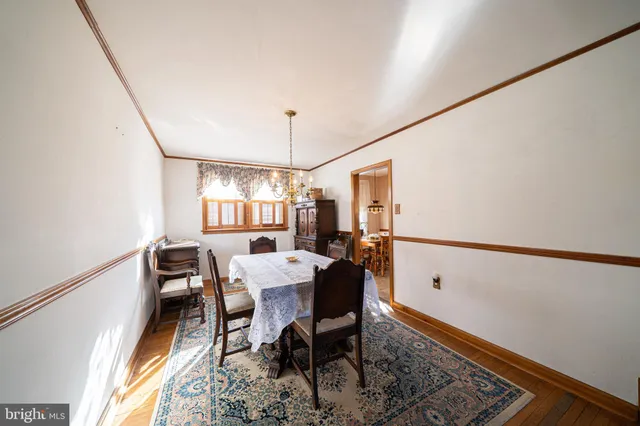 a view of a dining room with furniture and window