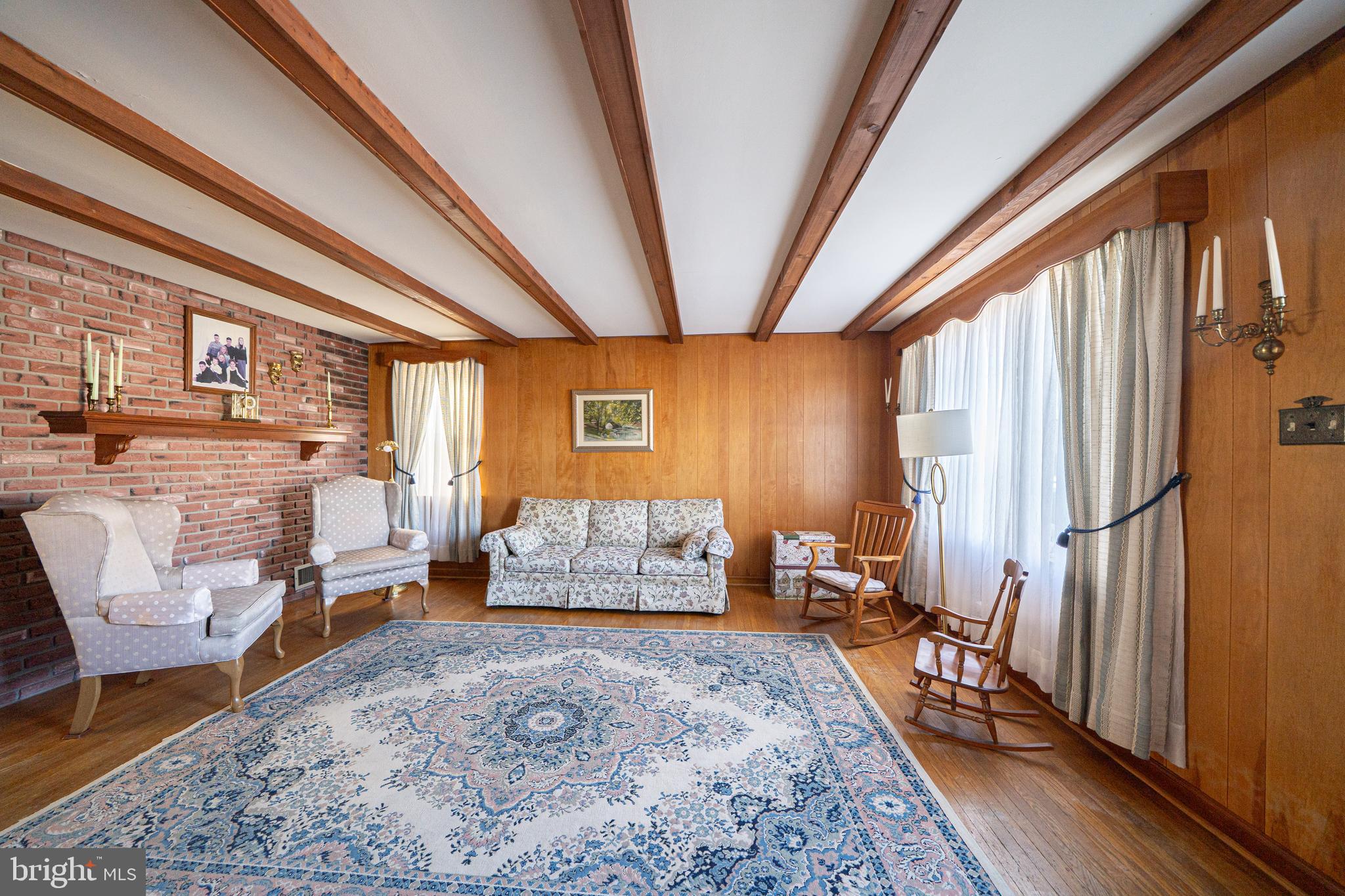 7409 Shisler Street Philadelphia, PA 19111 - Photo 7 of 27 a living room with furniture and a rug