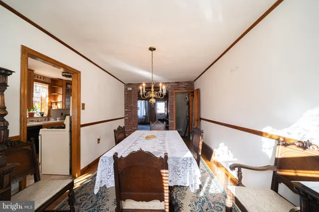 a view of a hallway with furniture and front door