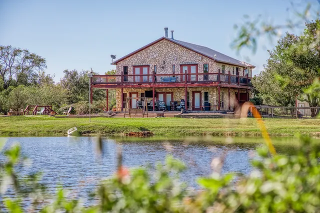 a view of a swimming pool with a garden and plants