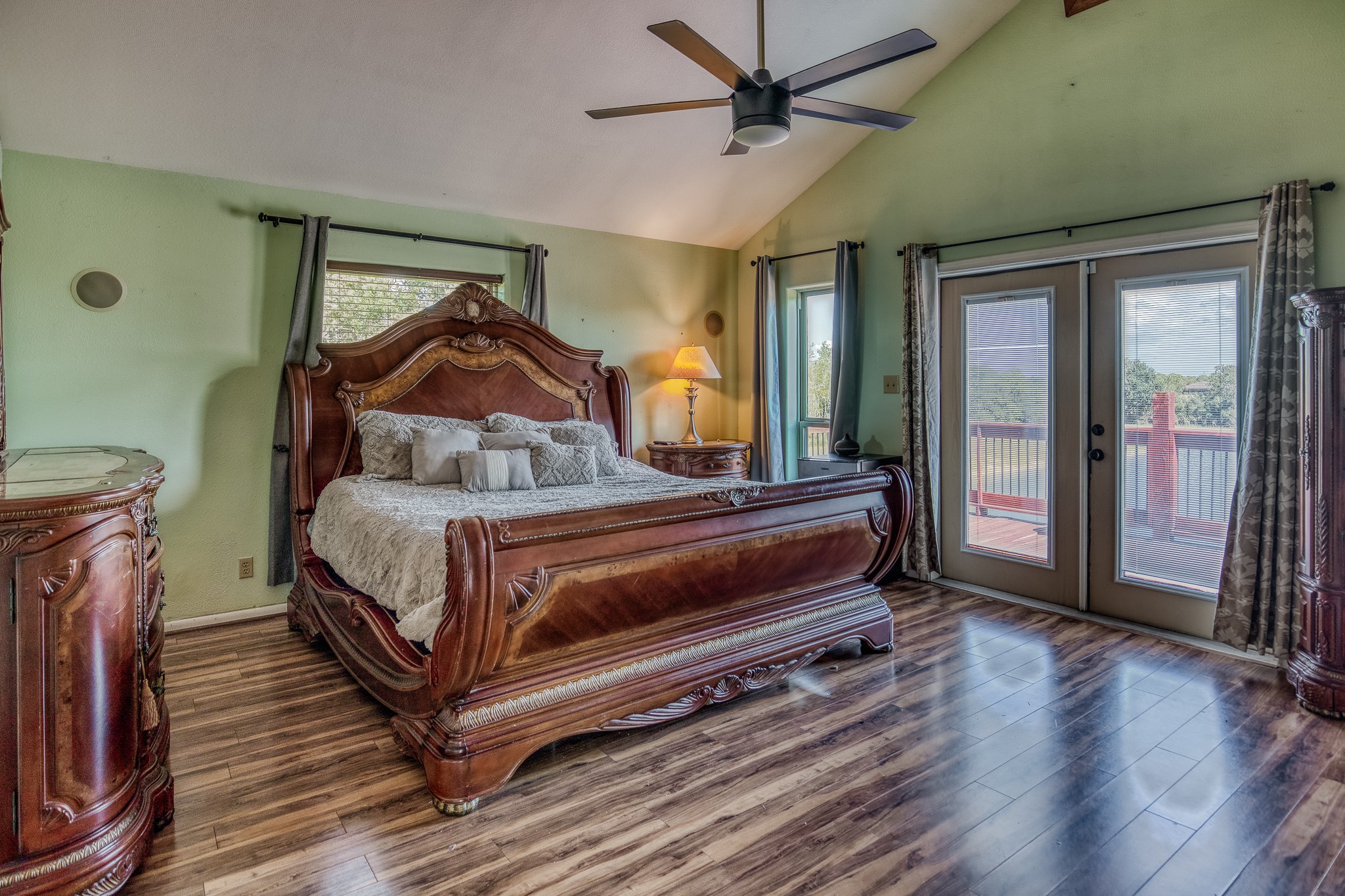 6510 Wig Street San Leon, TX 77539 - Photo 18 of 41 a bedroom with a bed and wooden floor