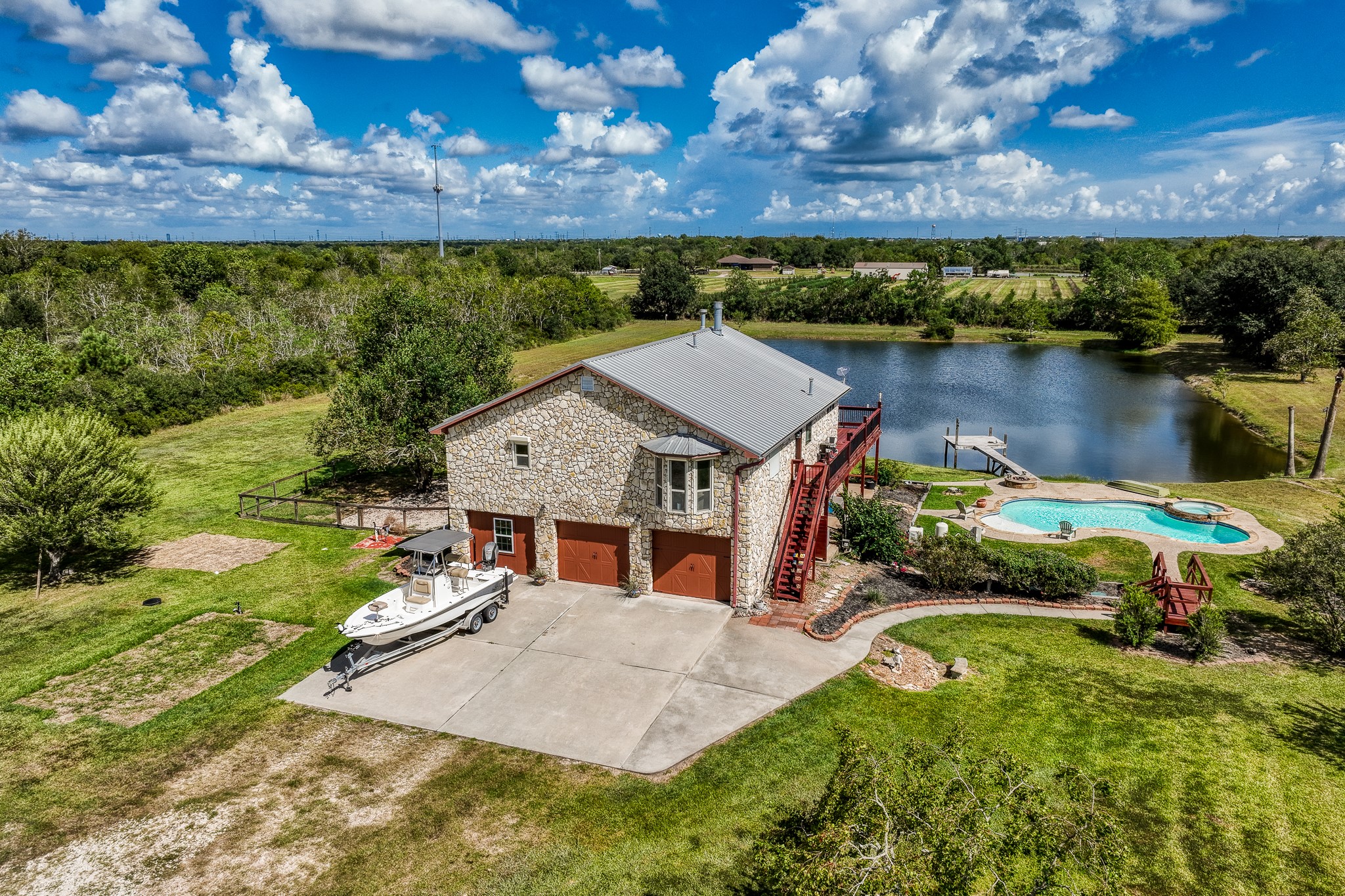 6510 Wig Street San Leon, TX 77539 - Photo 2 of 41 a view of house with swimming pool and lake view