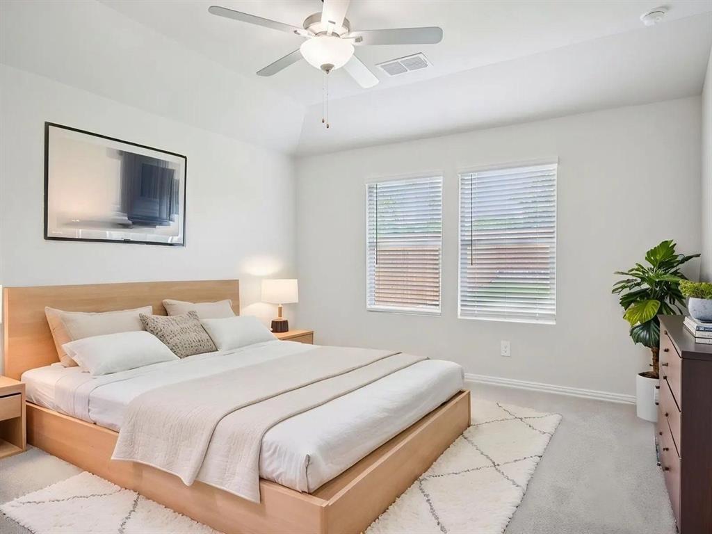 6400 Texas Ranger Trail Fort Worth, TX 76123 - Photo 5 of 14 a bedroom with a bed and a potted plant