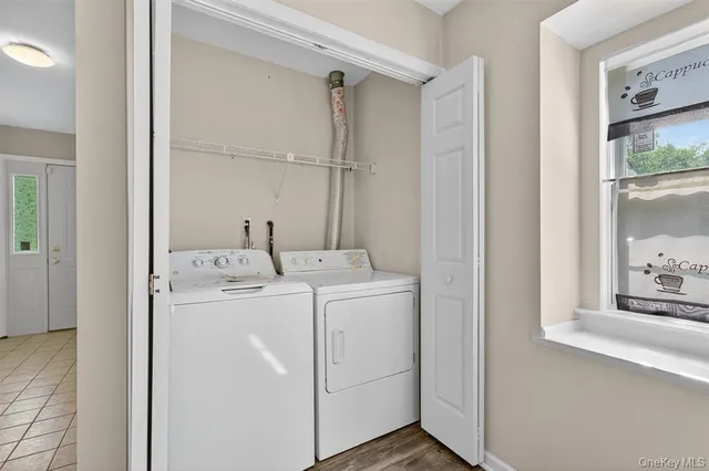 a utility room with dryer and washer