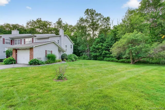 a house view with garden space