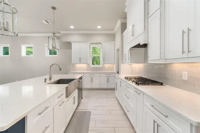 a bathroom with a sink and a washer dryer