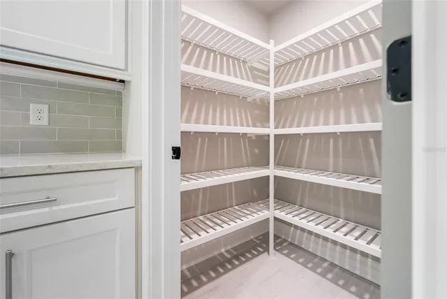 a bathroom with a sink toilet and a mirror