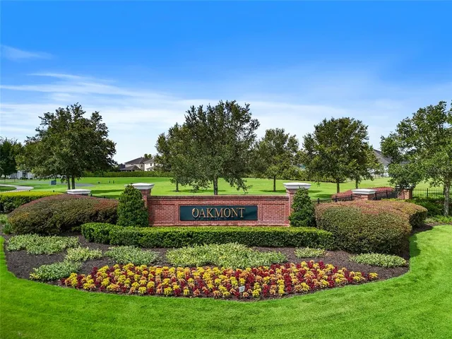a view of a garden with a building in the background