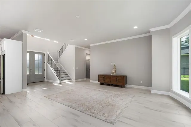 a view of an empty room with a window