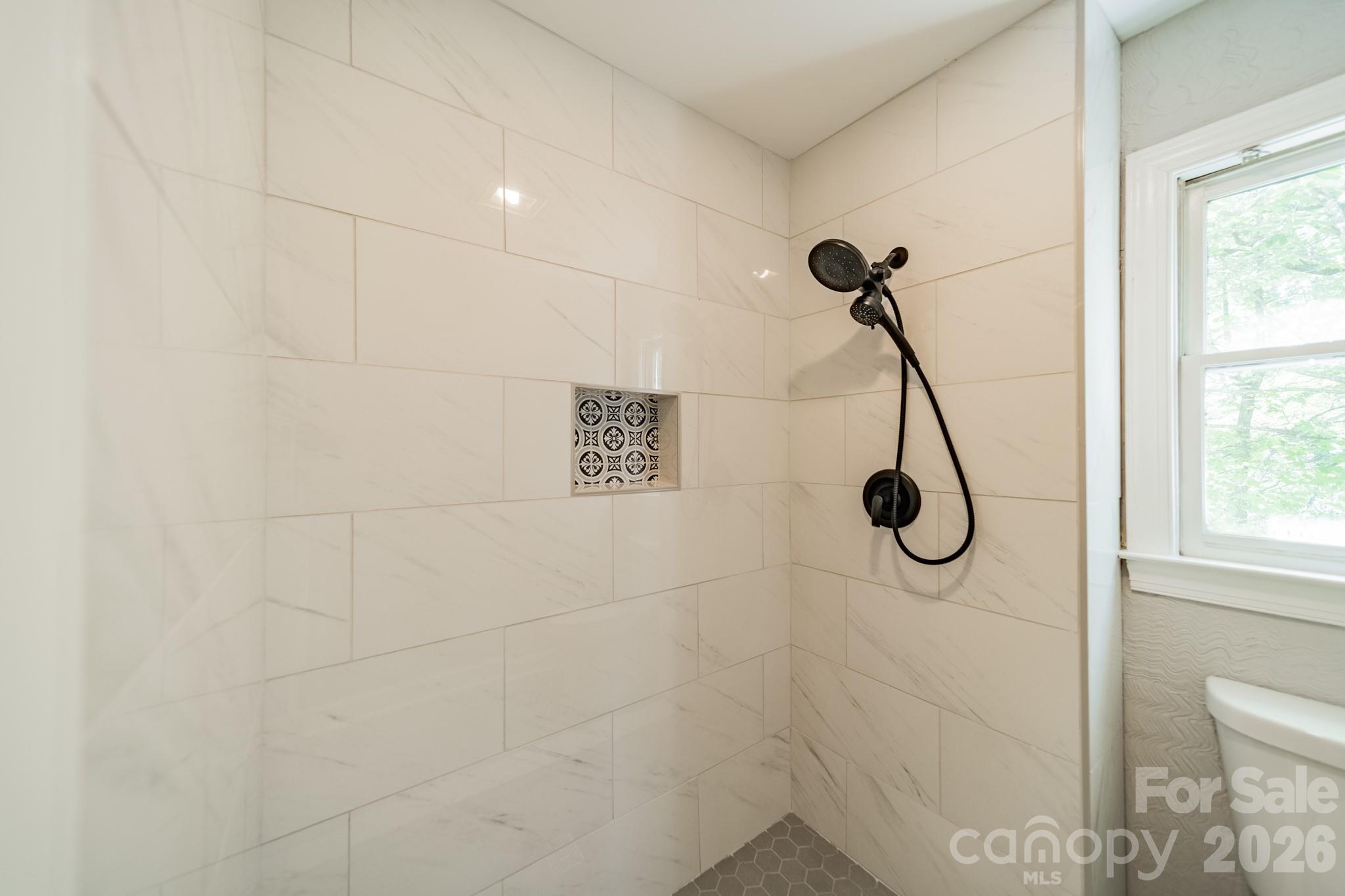 11043 Seven Coves Drive Tega Cay, SC 29708 - Photo 33 of 45 a bathroom with a shower