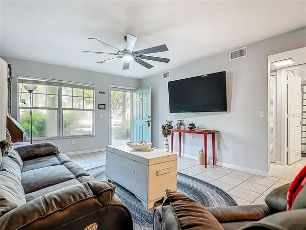 a kitchen with stainless steel appliances kitchen island granite countertop a refrigerator and stove