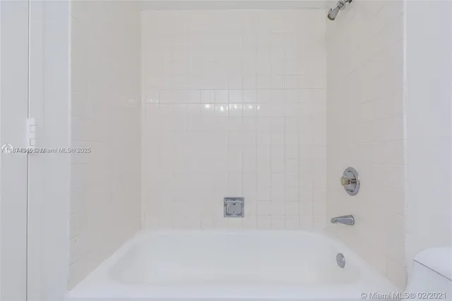 a view of swimming pool with chairs