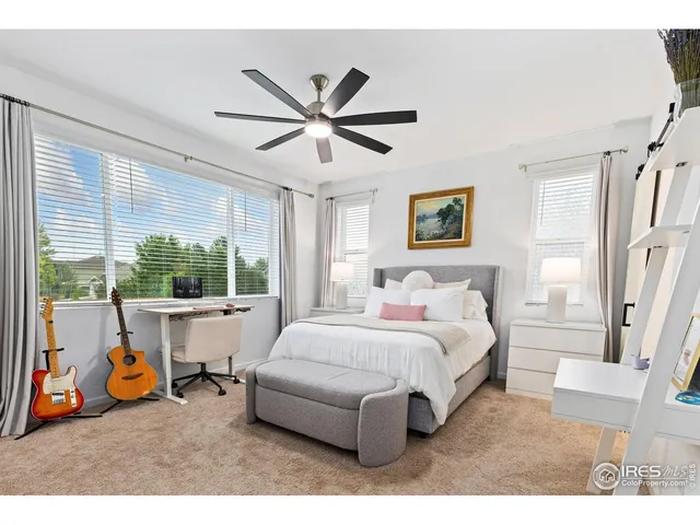 a bed room with a bed and a window