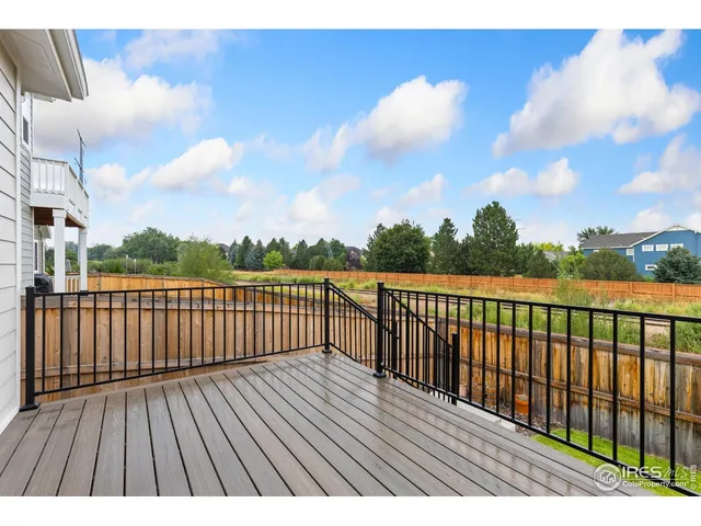 a view of balcony with wooden floor