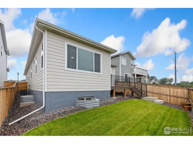 a backyard view with a chair and table