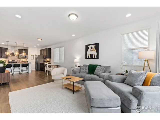 a living room with furniture and a table