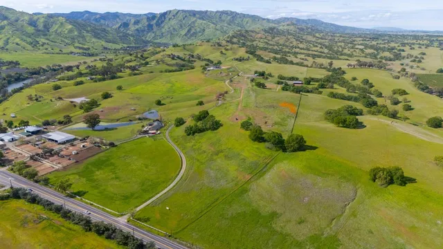 an aerial view of a house with yard swimming pool and outdoor seating