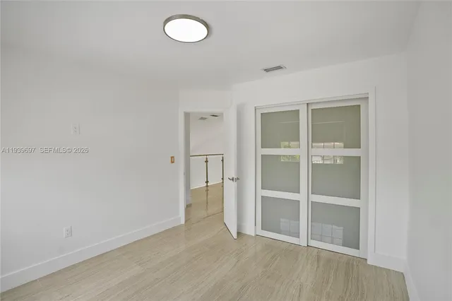 a bathroom with a sink vanity and mirror