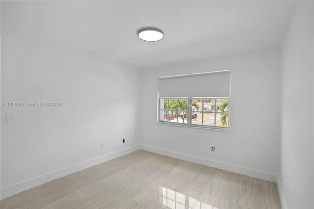 a bathroom with a sink toilet and mirror