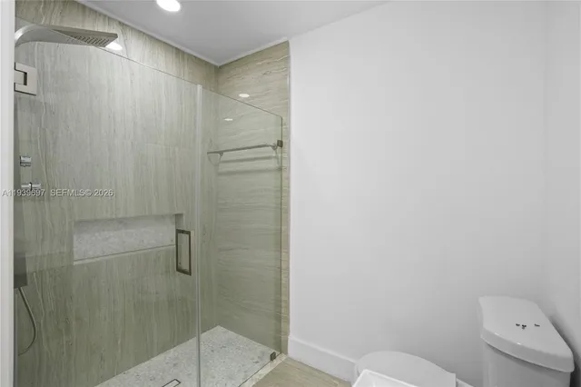 a bathroom with a shower and a sink