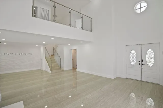 a view of kitchen with furniture and wooden floor