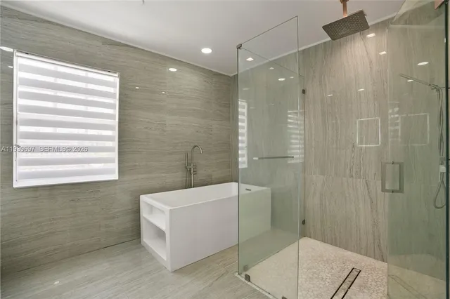 a palm tree sitting in front of a house with a yard