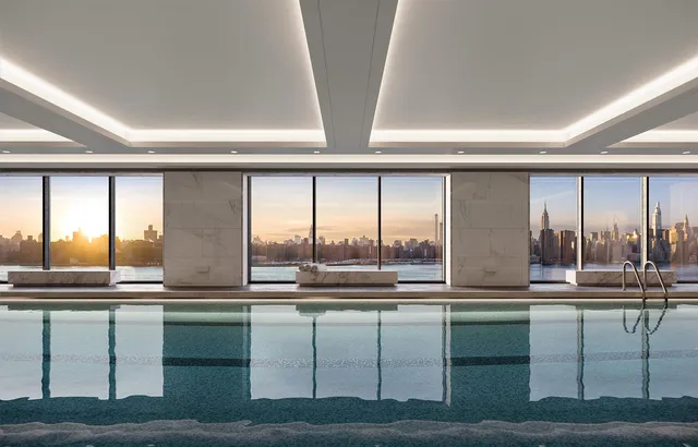 a view of room with stainless steel appliances wooden floor and large windows