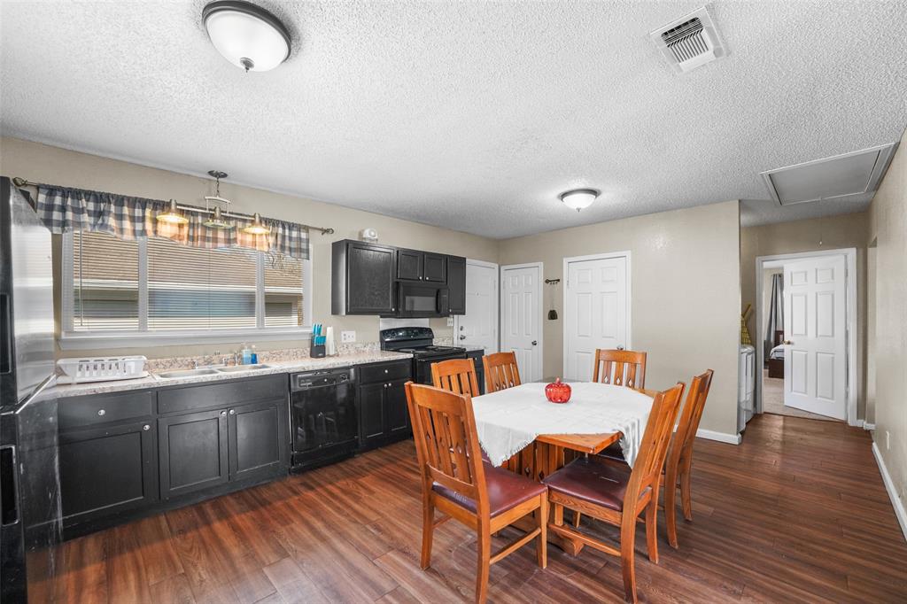 1145 Jefferson Road Paris, TX 75460 - Photo 8 of 17 a view of a dining room with furniture and window