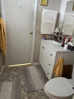 a bathroom with a sink and toilet