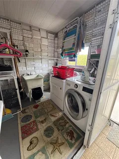 a kitchen with stainless steel appliances a stove a sink and white cabinets