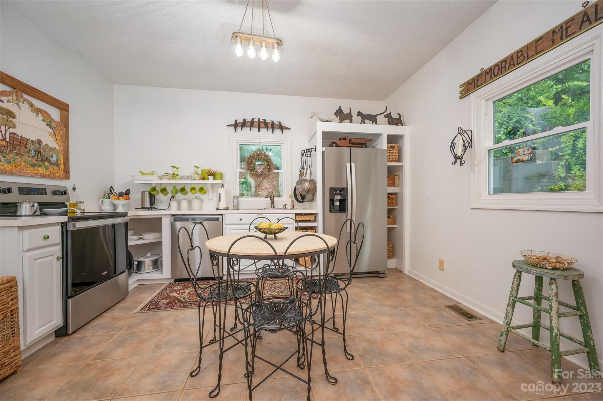 196 Screven Road Tryon, NC 28782 - Photo 12 of 31 a view of a dining room with furniture window and outside view