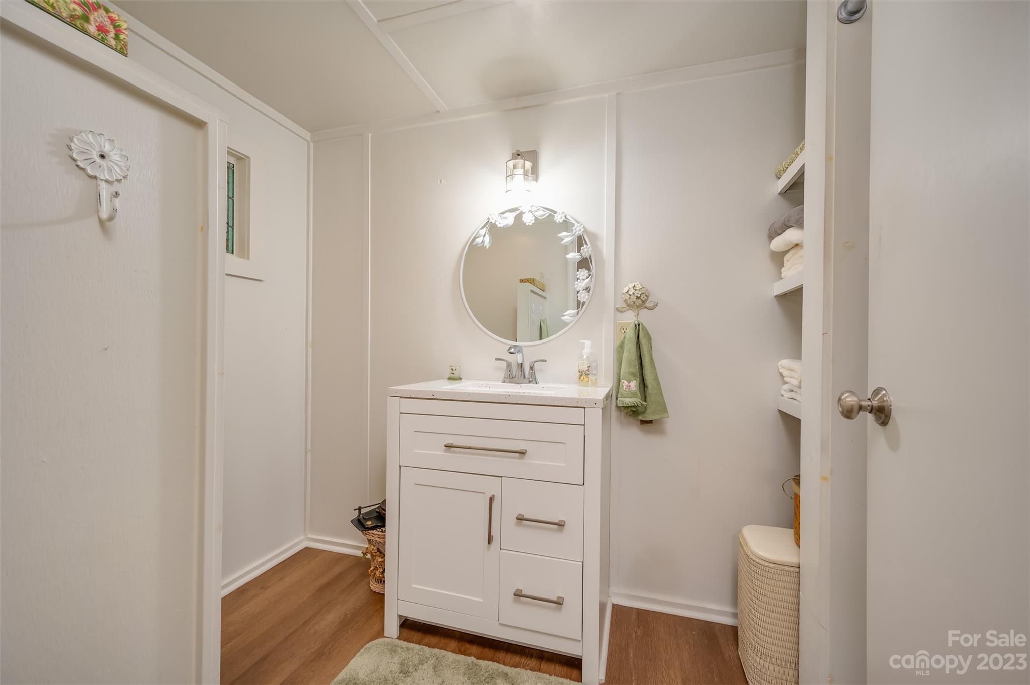 196 Screven Road Tryon, NC 28782 - Photo 22 of 31 a bathroom with a sink a toilet and shower